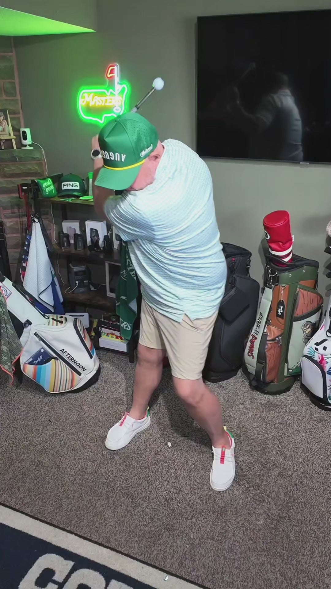 Golfer practicing swing tempo with a telescopic tempo trainer